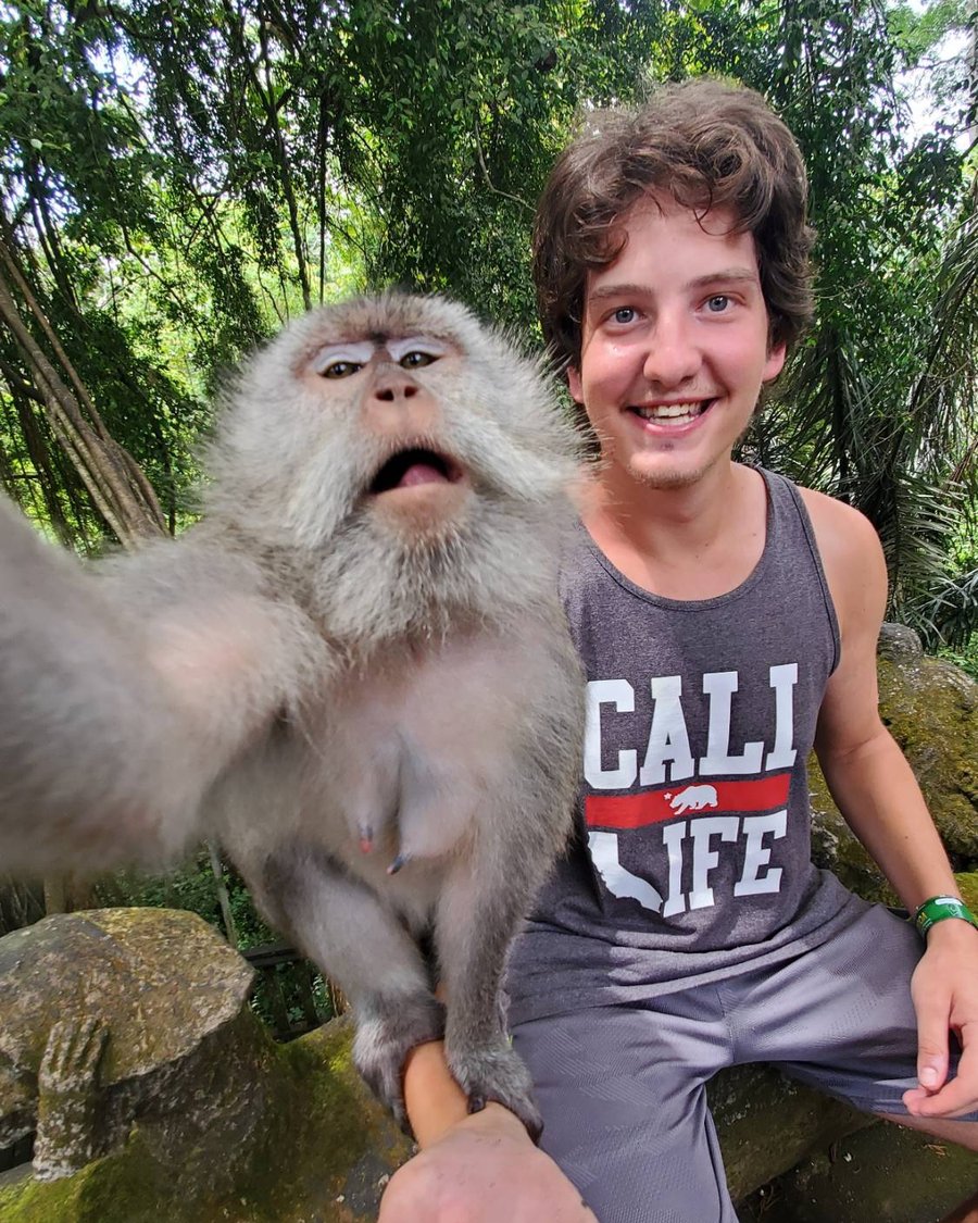 Noah taking a selfie with a monkey